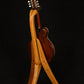 Folding cherry wood mandolin floor stand full rear image with Eastman mandolin