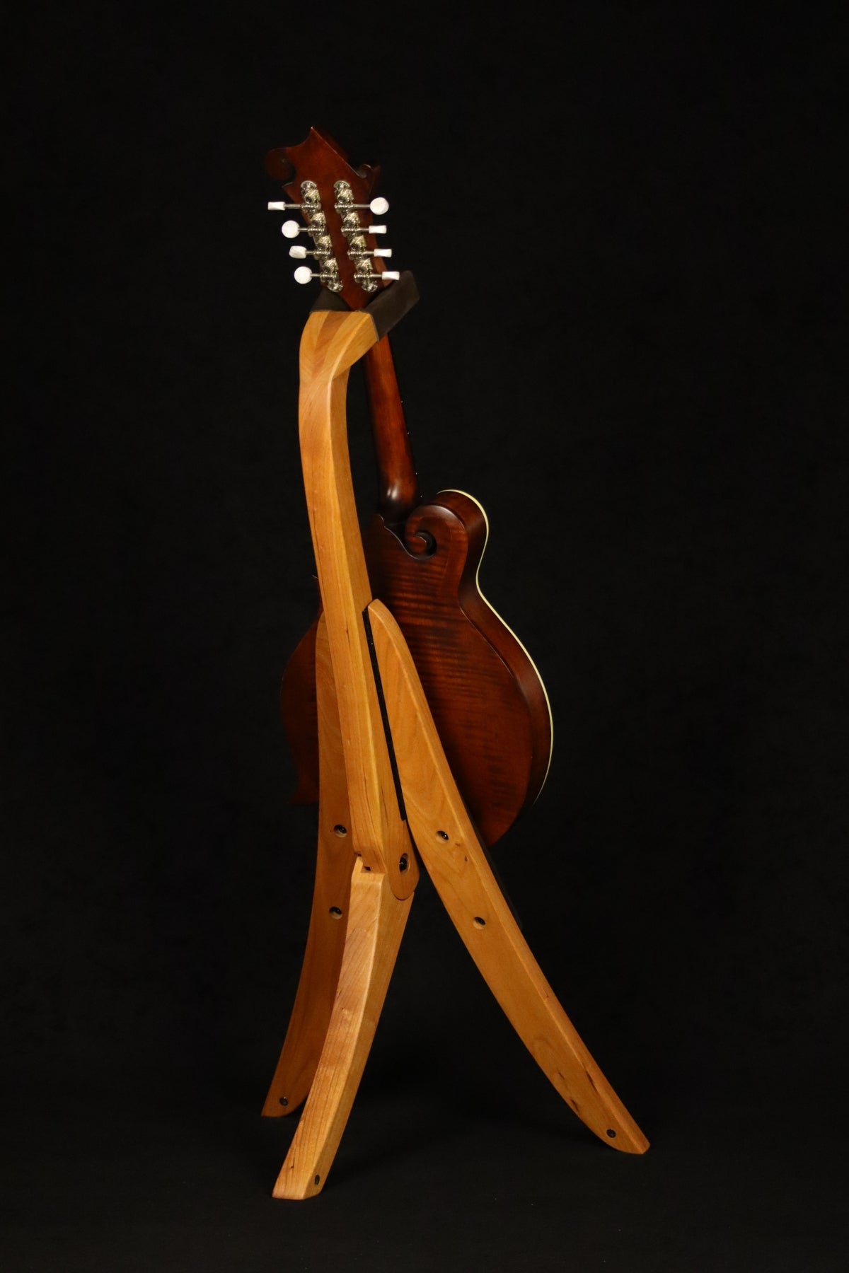 Folding cherry wood mandolin floor stand full rear image with Eastman mandolin