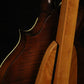 Folding cherry wood mandolin floor stand closeup rear image with Eastman mandolin