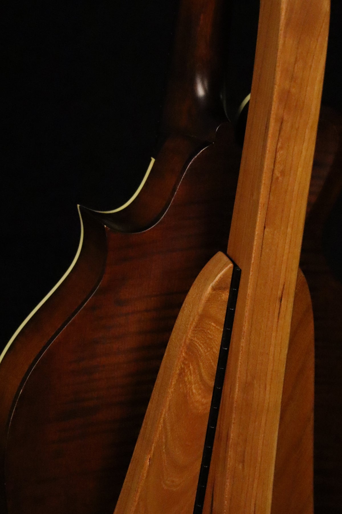 Folding cherry wood mandolin floor stand closeup rear image with Eastman mandolin