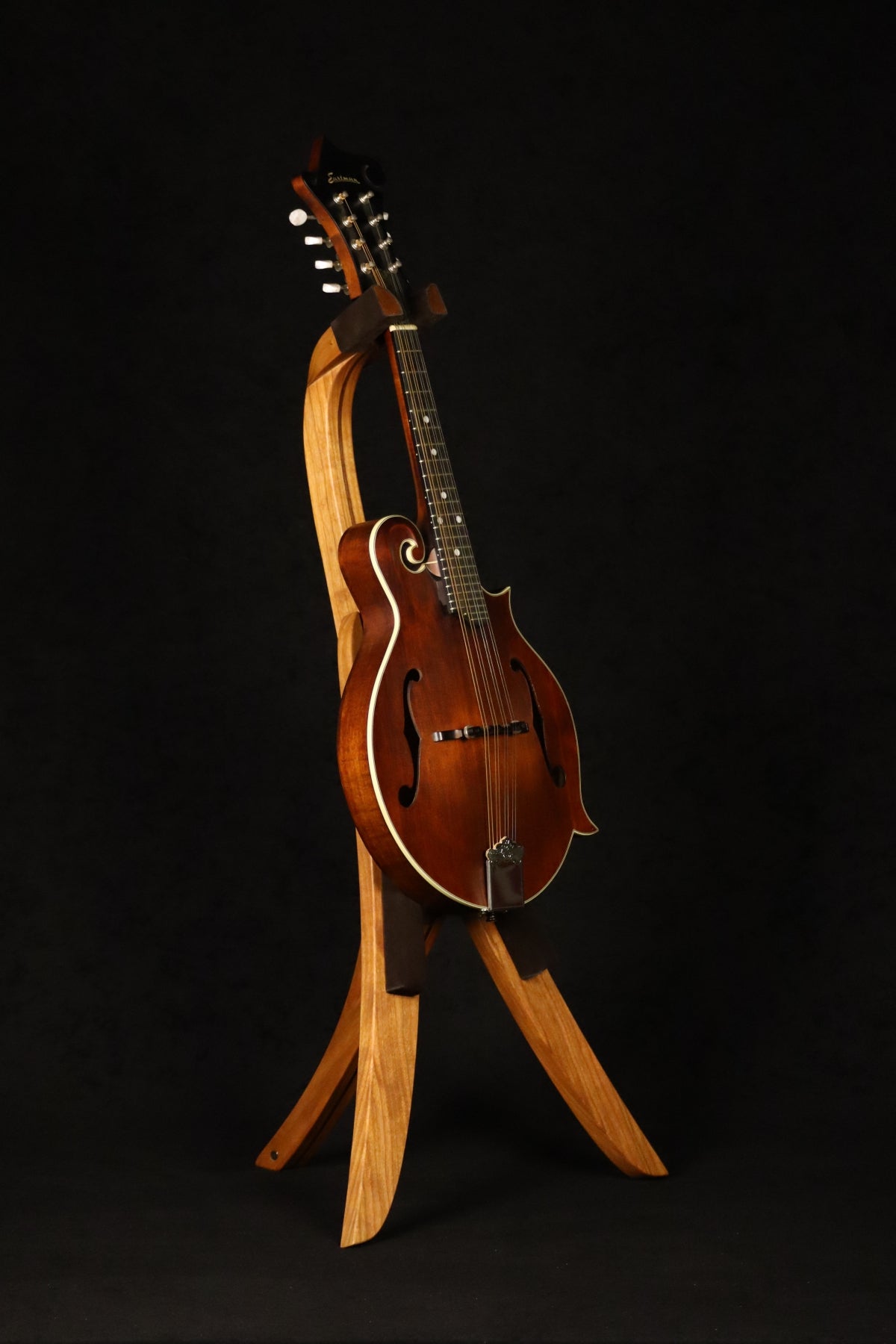 Folding cherry and walnut wood mandolin floor stand full front image with Eastman mandolin