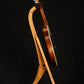 Folding cherry and walnut wood mandolin floor stand full side image with Eastman mandolin