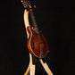 Folding curly maple wood mandolin floor stand full front image with Eastman mandolin