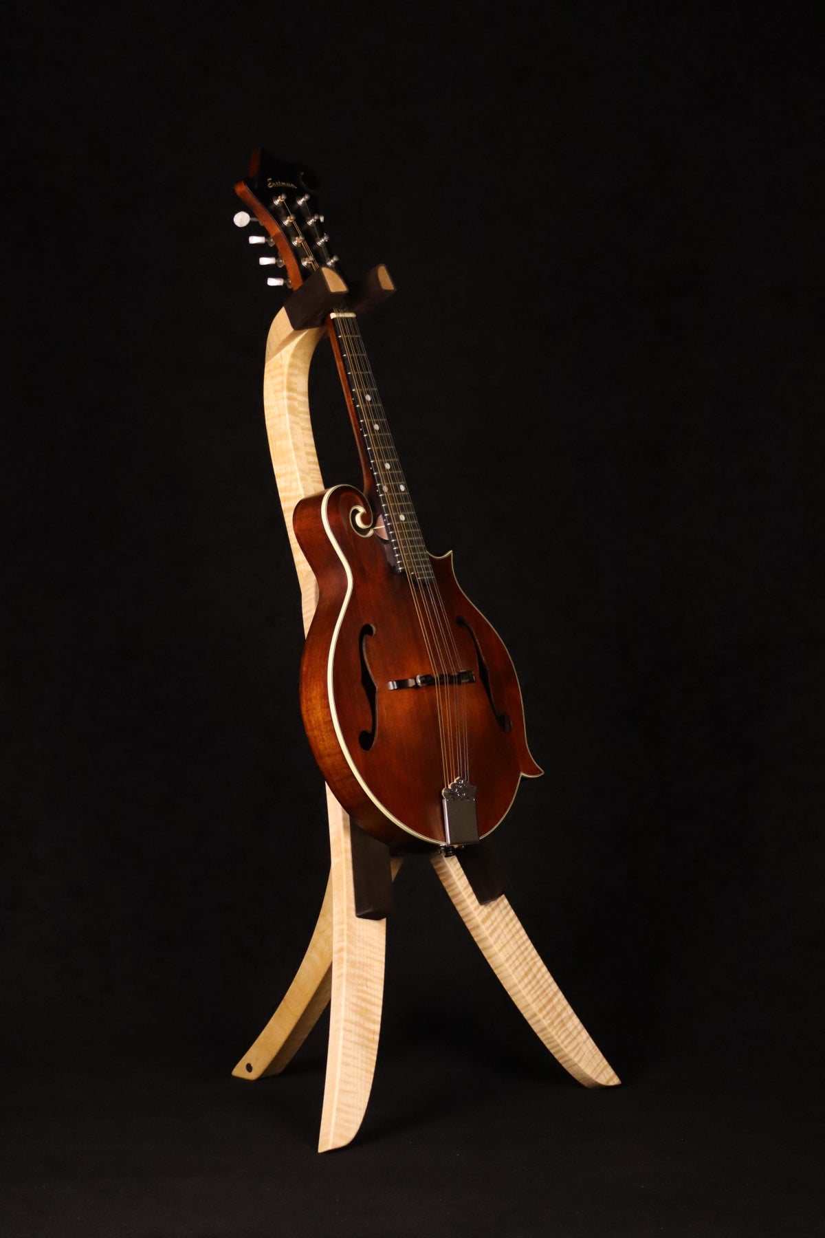 Folding curly maple wood mandolin floor stand full front image with Eastman mandolin