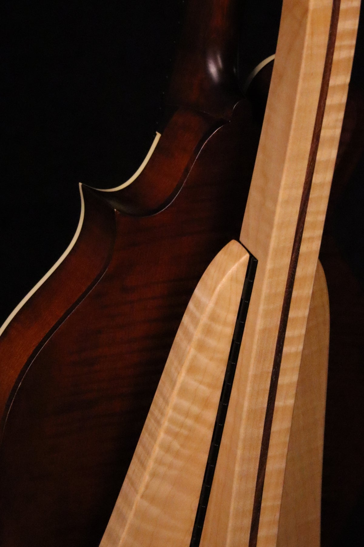 Folding curly maple and walnut wood mandolin floor stand closeup rear image with Eastman mandolin
