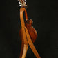 Folding sapele mahogany wood mandolin floor stand full rear image with Eastman mandolin
