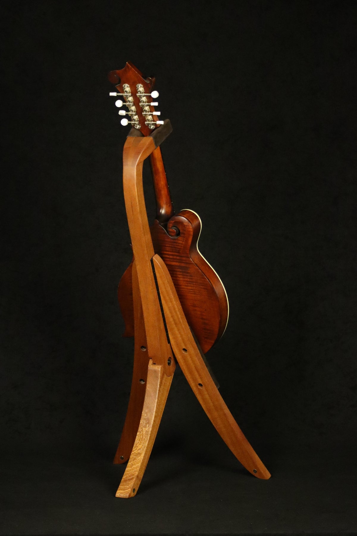 Folding sapele mahogany wood mandolin floor stand full rear image with Eastman mandolin