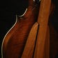 Folding sapele mahogany wood mandolin floor stand closeup rear image with Eastman mandolin