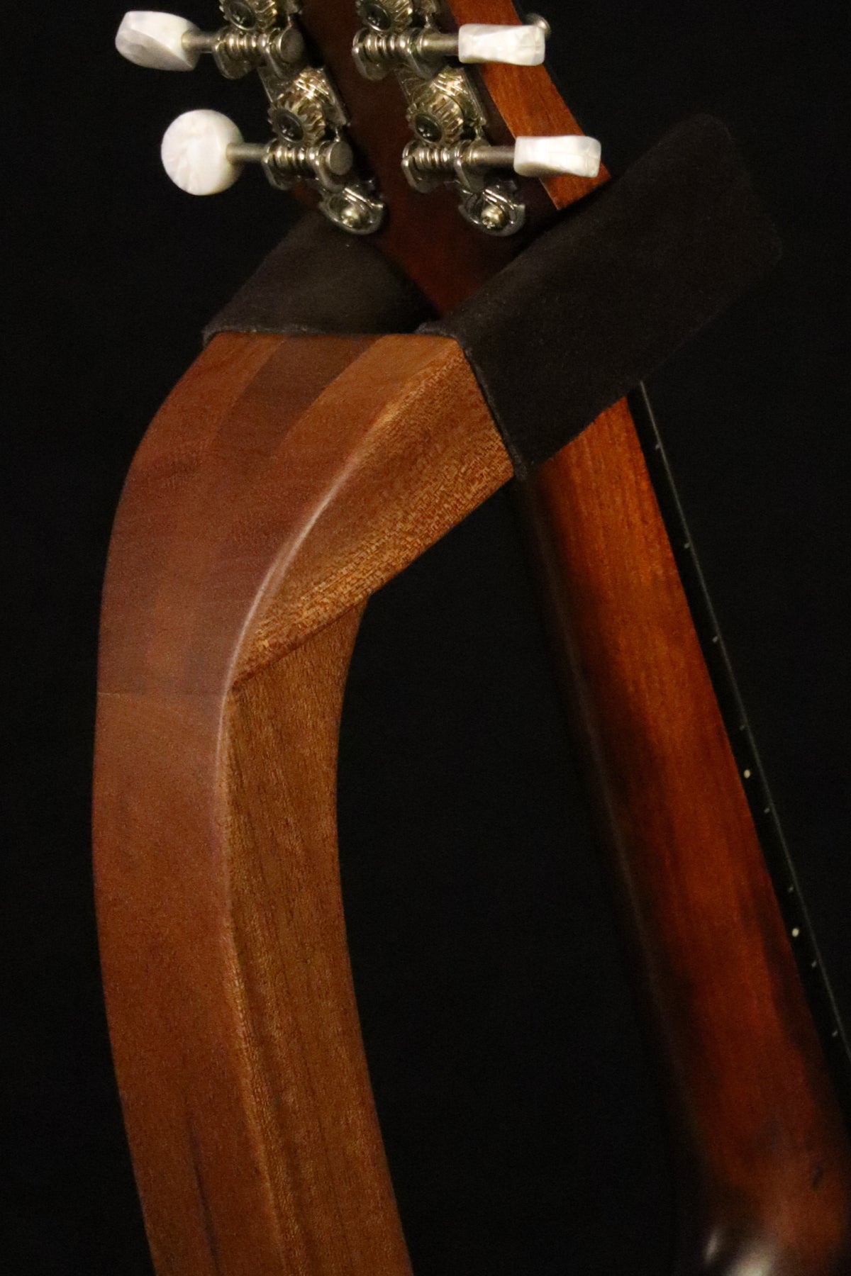Folding sapele mahogany wood mandolin floor stand yoke detail image with Eastman mandolin