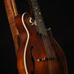 Folding sapele mahogany and curly maple wood mandolin floor stand closeup front image with Eastman mandolin