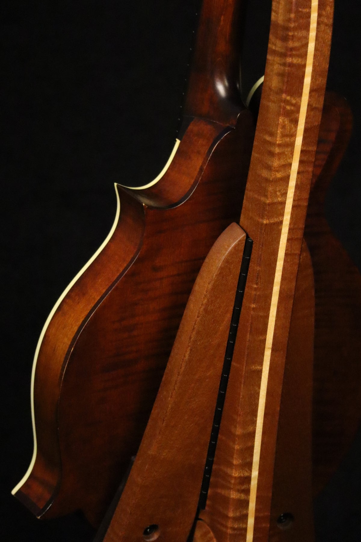 Folding sapele mahogany and curly maple wood mandolin floor stand closeup rear image with Eastman mandolin