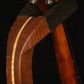 Folding sapele mahogany and curly maple wood mandolin floor stand yoke detail image with Eastman mandolin