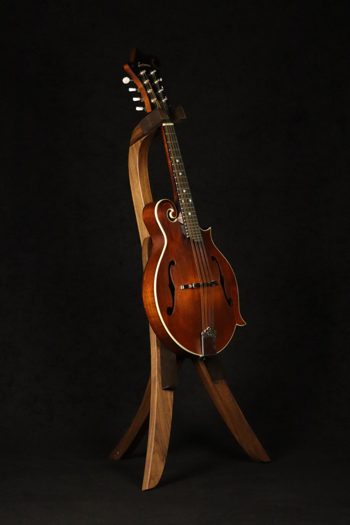 Folding walnut wood mandolin floor stand full front image with Eastman mandolin