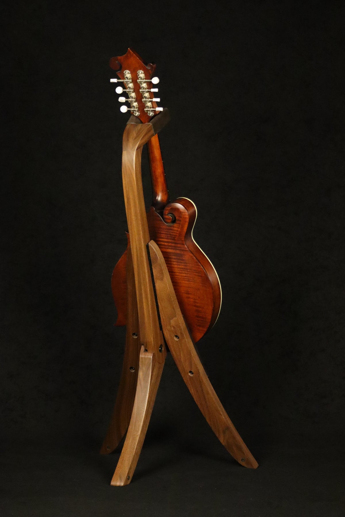 Folding walnut wood mandolin floor stand full rear image with Eastman mandolin