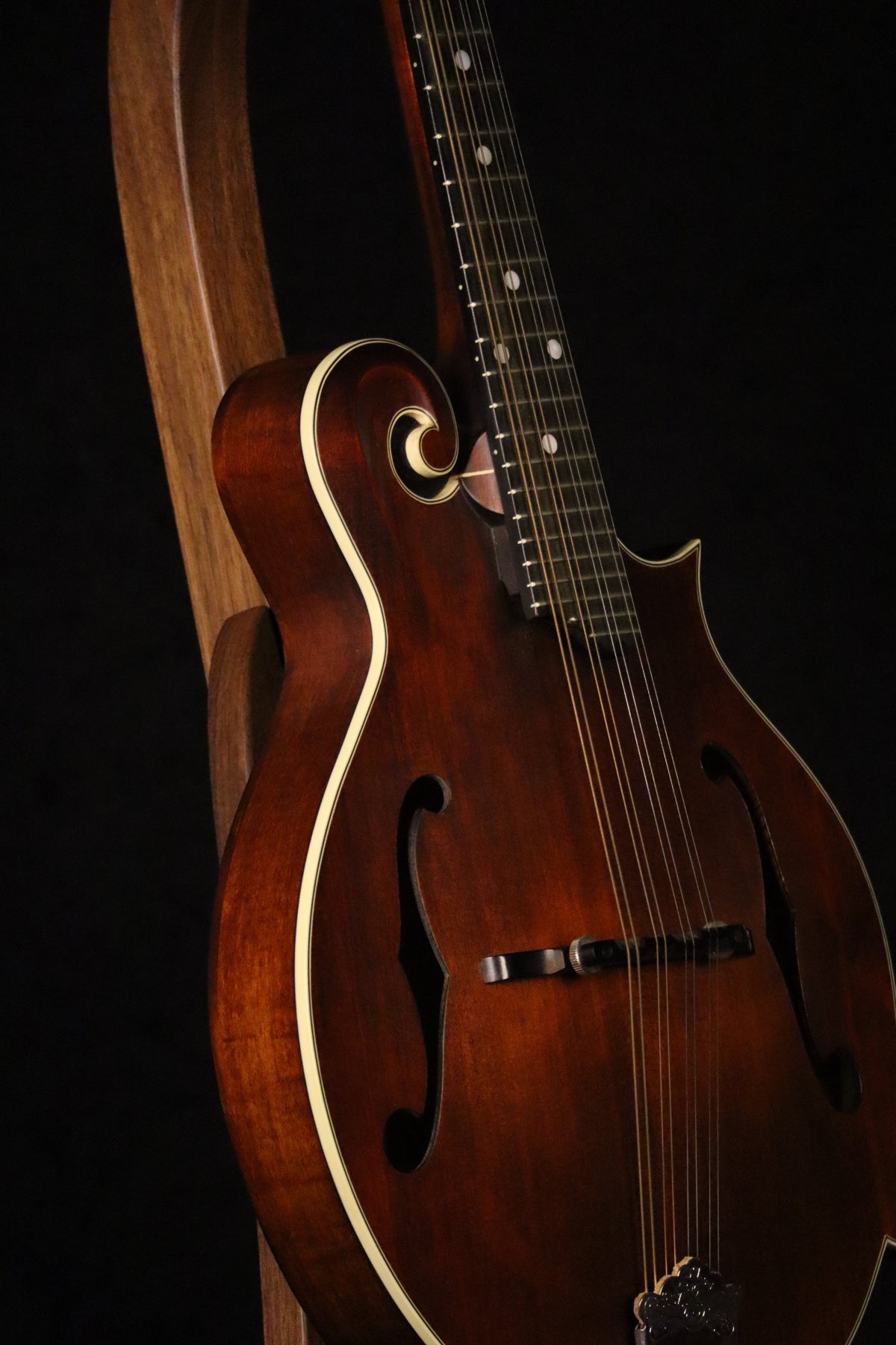 Folding walnut wood mandolin floor stand closeup front image with Eastman mandolin