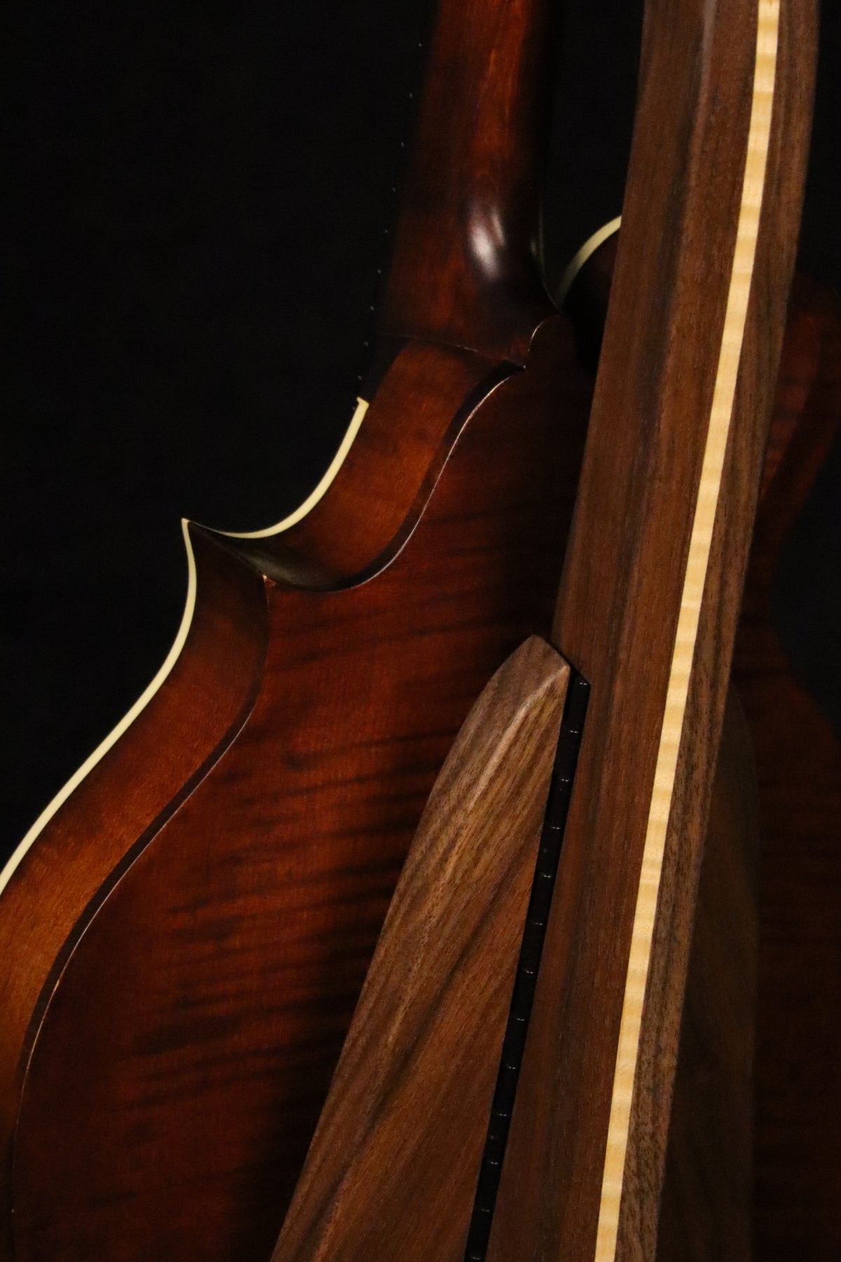 Folding walnut and curly maple wood mandolin floor stand closeup rear image with Eastman mandolin