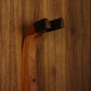 Sapele mahogany wood guitar wall mount hanger installed on paneled wall