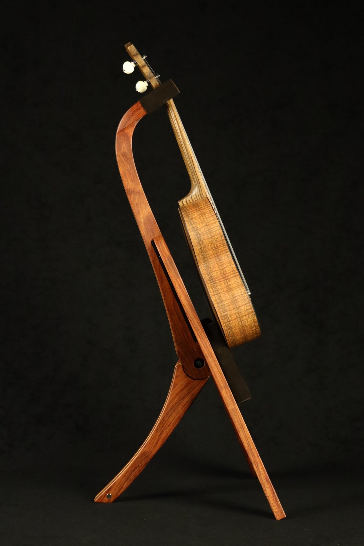 Folding bubinga rosewood and curly maple wood ukulele floor stand full side image with Martin ukulele