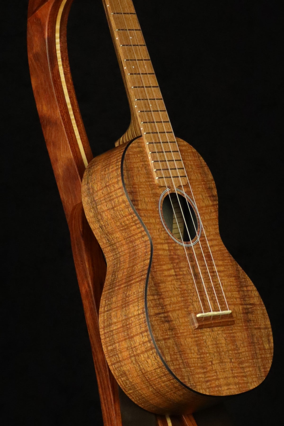 Folding bubinga rosewood and curly maple wood ukulele floor stand closeup front image with Martin ukulele