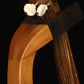 Folding cherry wood ukulele floor stand yoke detail image with Martin ukulele