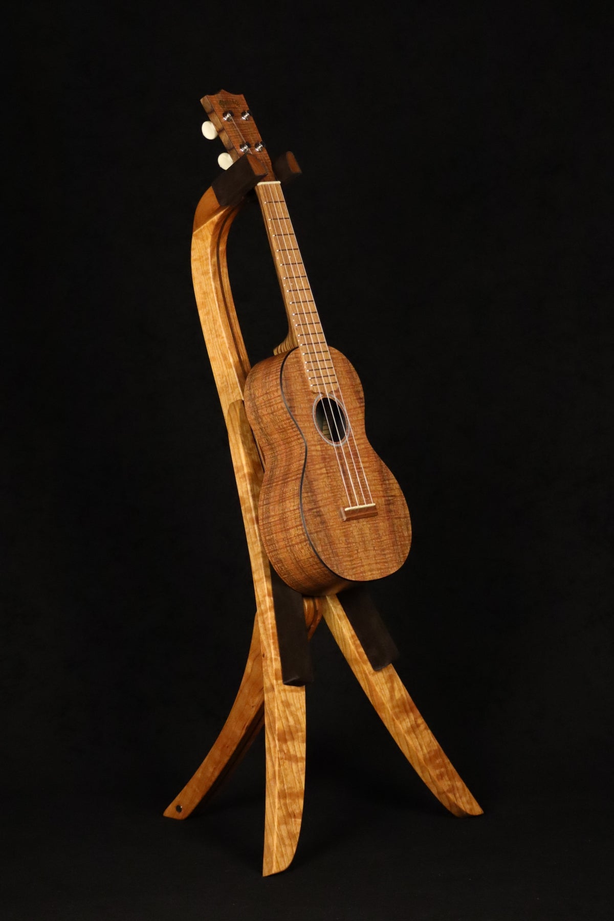 Folding cherry and walnut wood ukulele floor stand full front image with Martin ukulele