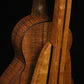 Folding cherry and walnut wood ukulele floor stand closeup rear image with Martin ukulele
