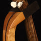 Folding cherry and walnut wood ukulele floor stand yoke detail image with Martin ukulele