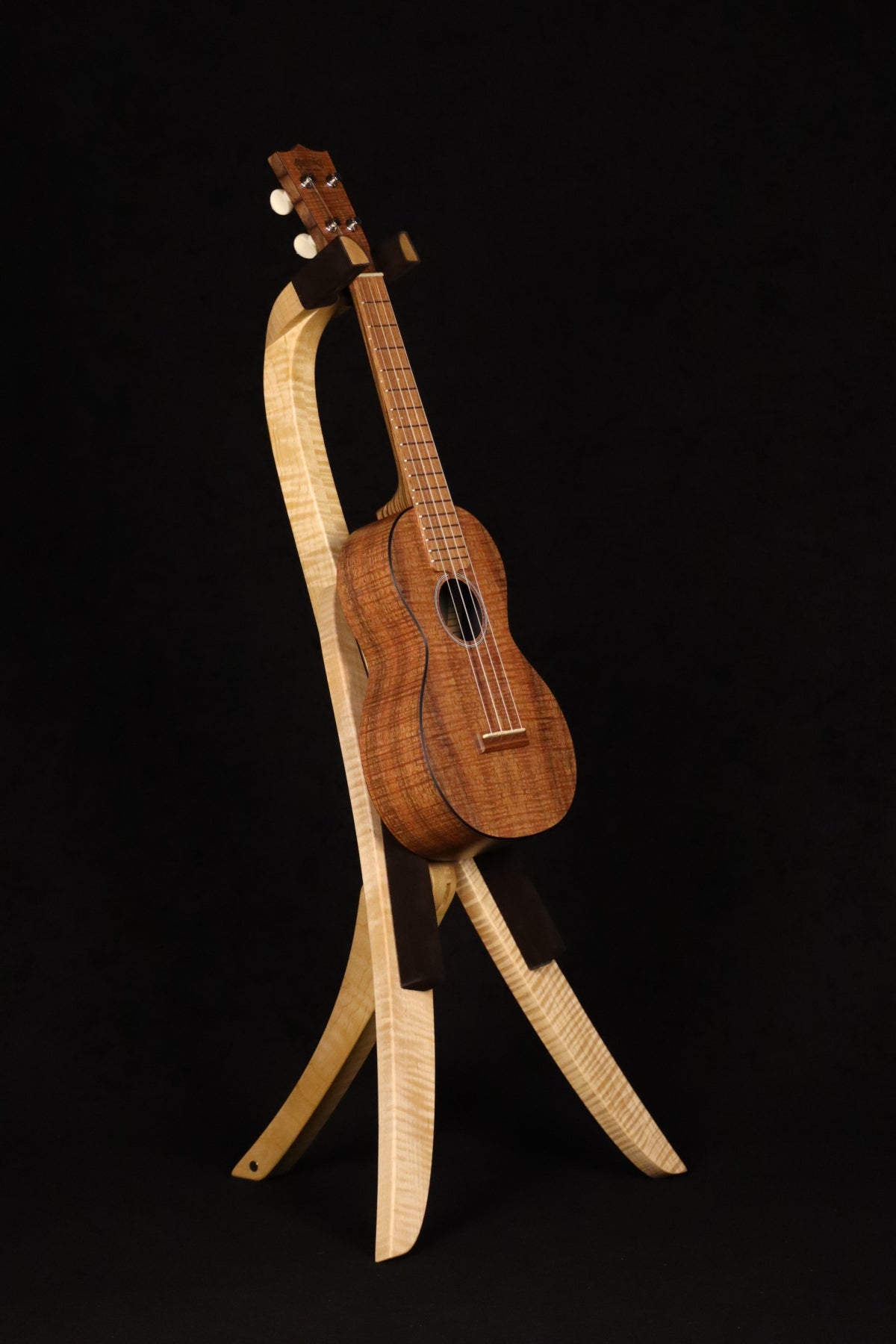 Folding curly maple wood ukulele floor stand full front image with Martin ukulele