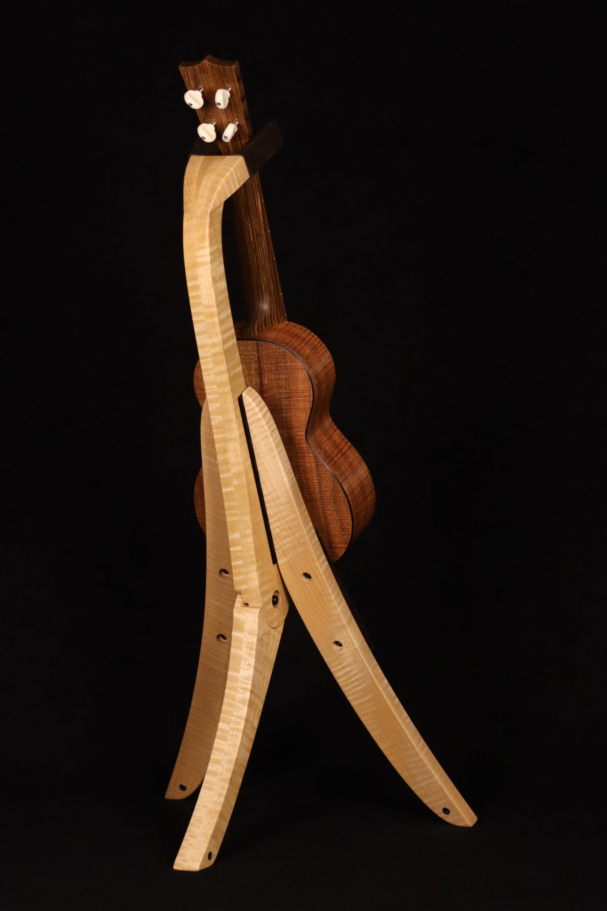 Folding curly maple wood ukulele floor stand full rear image with Martin ukulele
