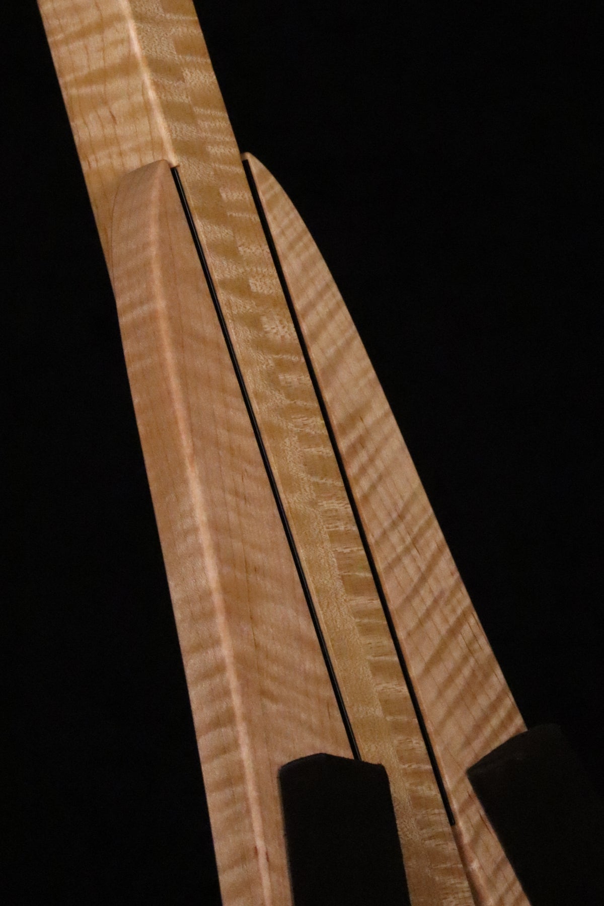 Folding curly maple wood ukulele floor stand closeup front image