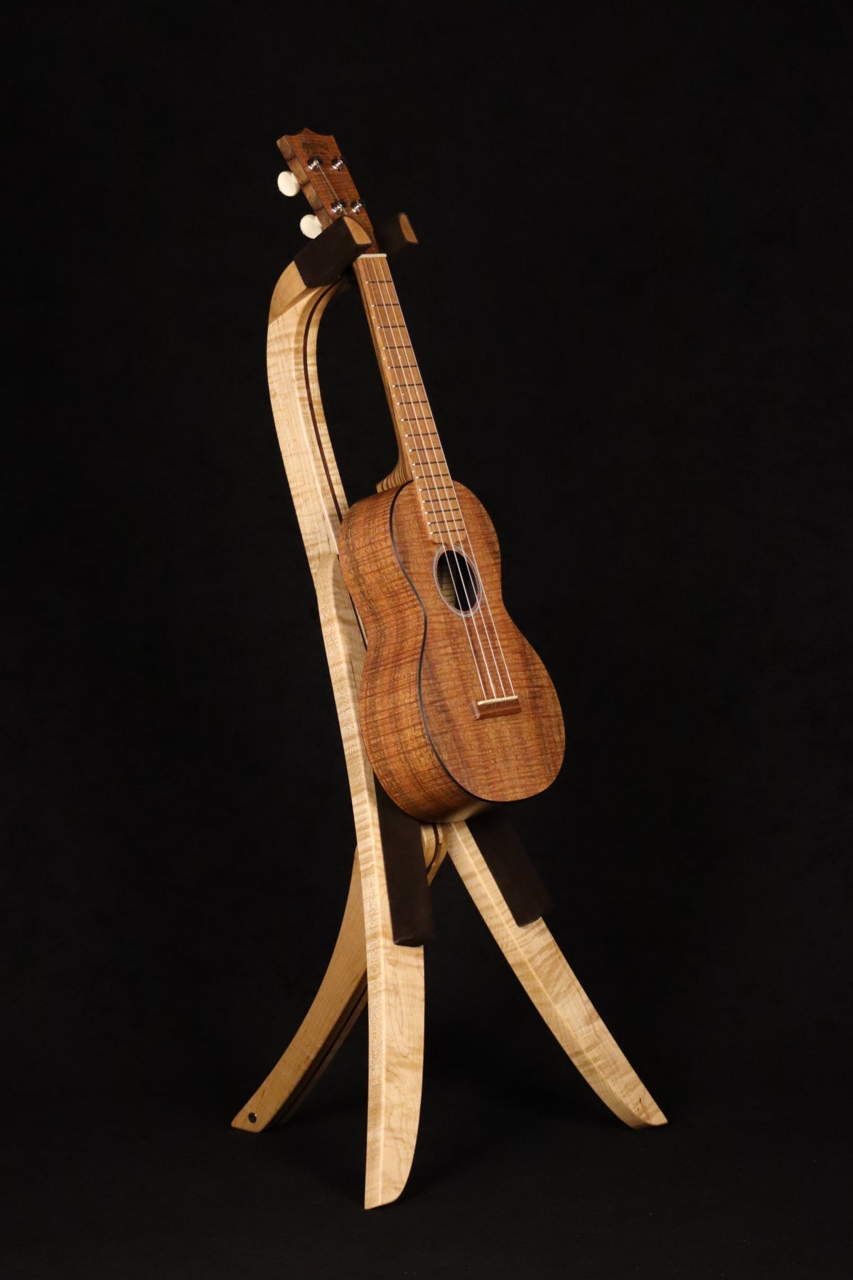Folding curly maple and walnut wood ukulele floor stand full front image with Martin ukulele