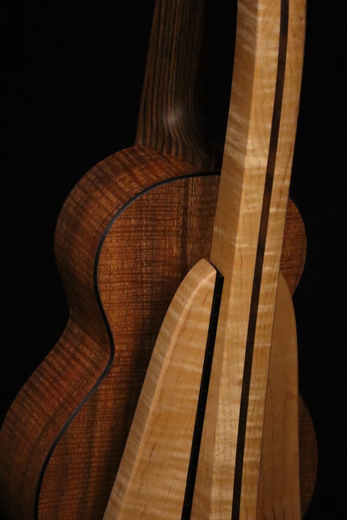 Folding curly maple and walnut wood ukulele floor stand closeup rear image with Martin ukulele