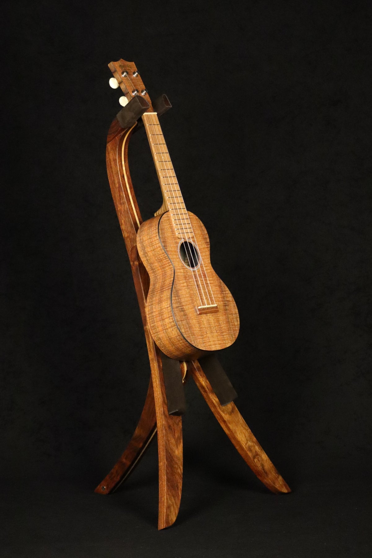 Folding chechen Caribbean rosewood and curly maple wood ukulele floor stand full front image with Martin ukulele