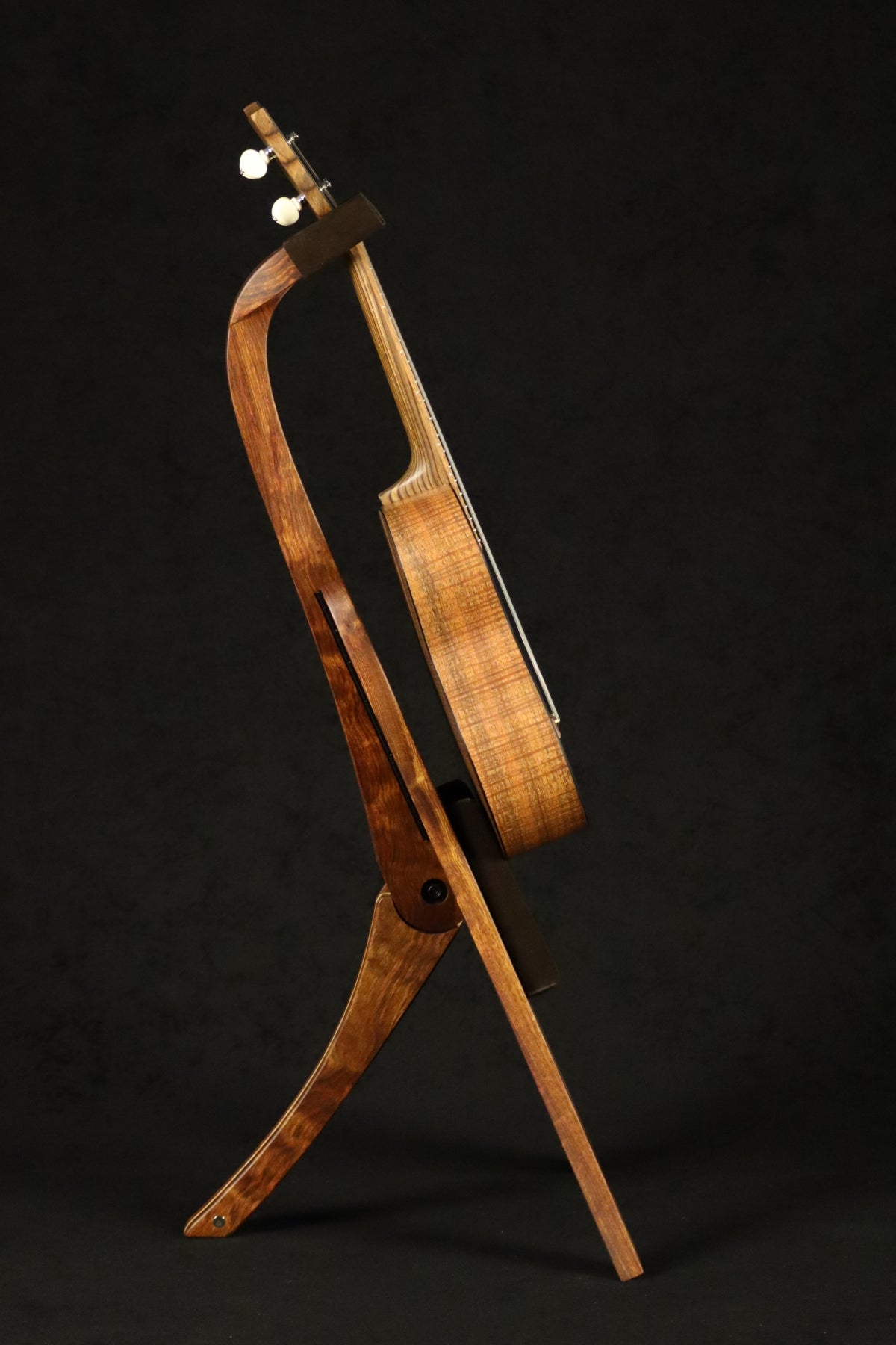 Folding chechen Caribbean rosewood and curly maple wood ukulele floor stand full side image with Martin ukulele