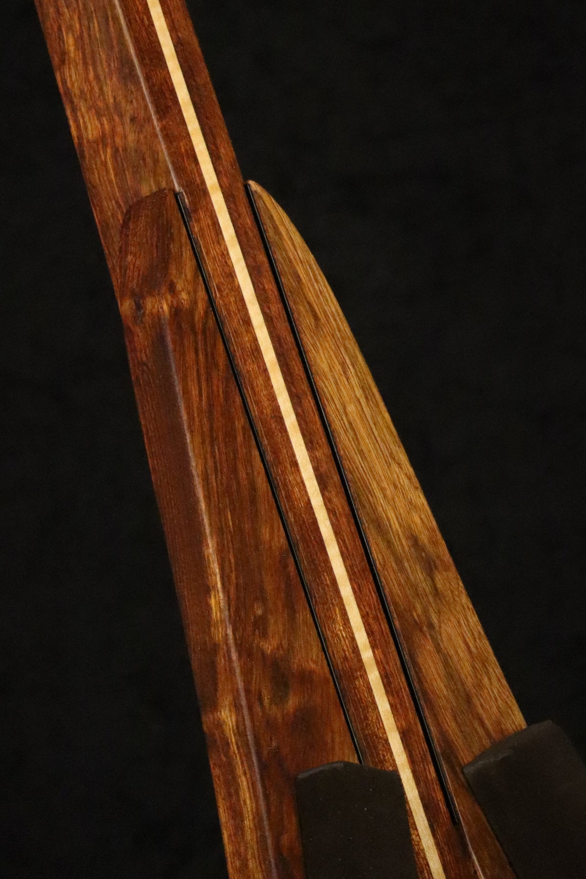 Folding chechen Caribbean rosewood and curly maple wood ukulele floor stand closeup front image