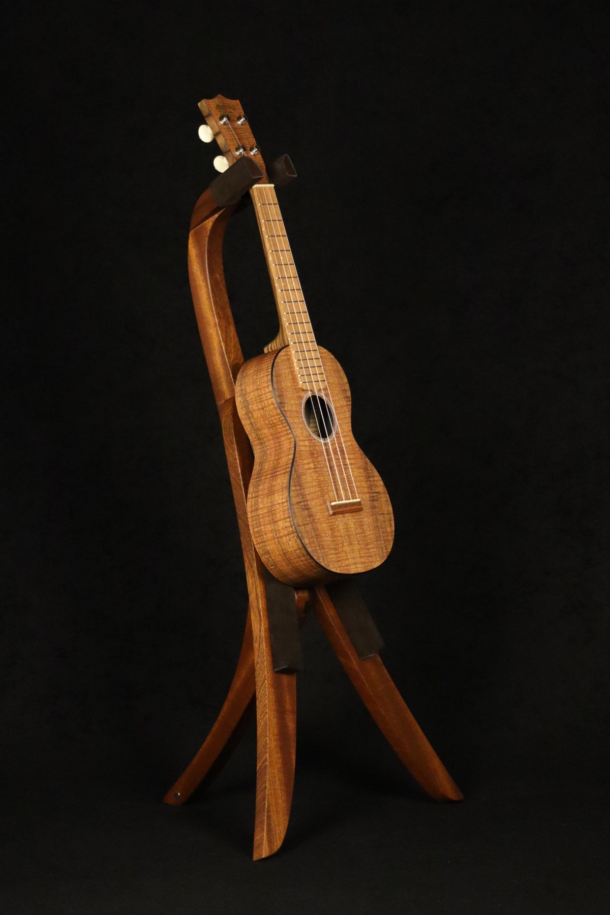 Folding sapele mahogany wood ukulele floor stand full front image with Martin ukulele