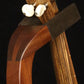Folding sapele mahogany wood ukulele floor stand yoke detail image with Martin ukulele