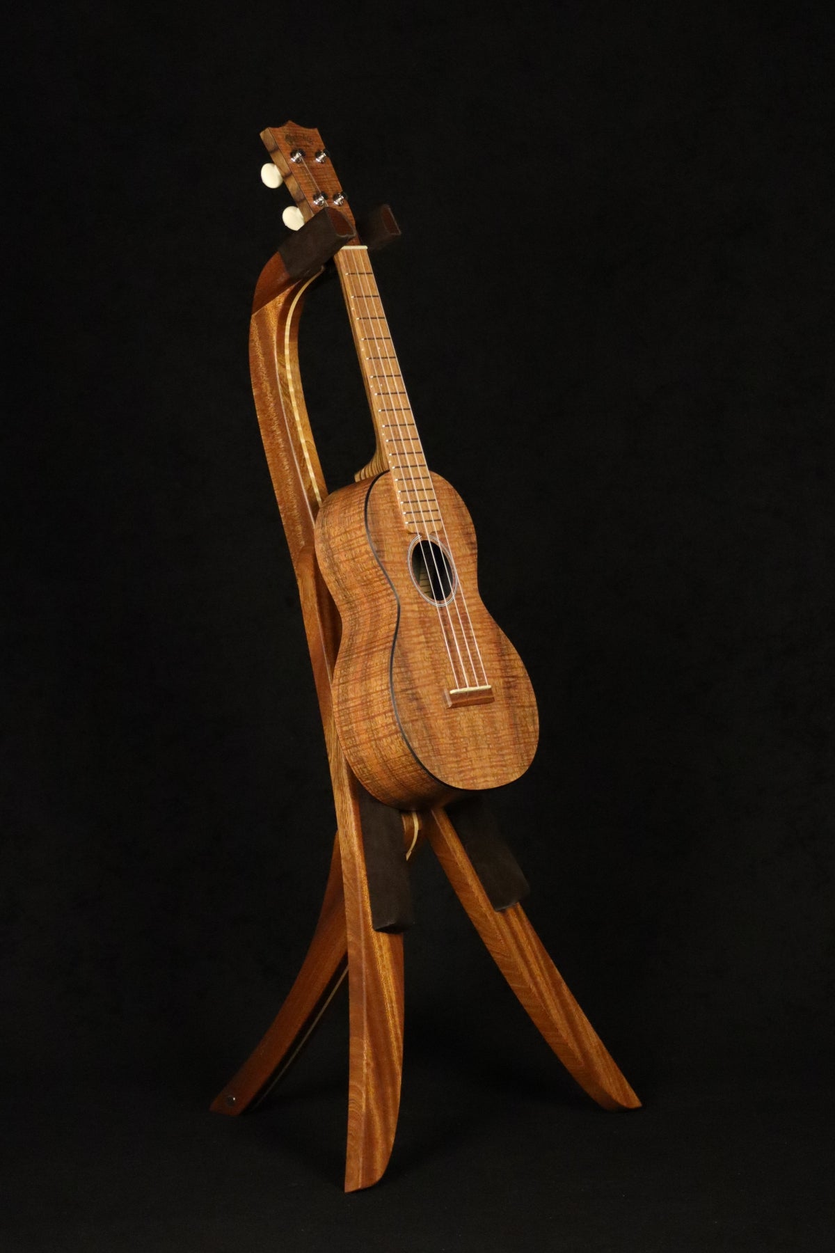 Folding sapele mahogany and curly maple wood ukulele floor stand full front image with Martin ukulele