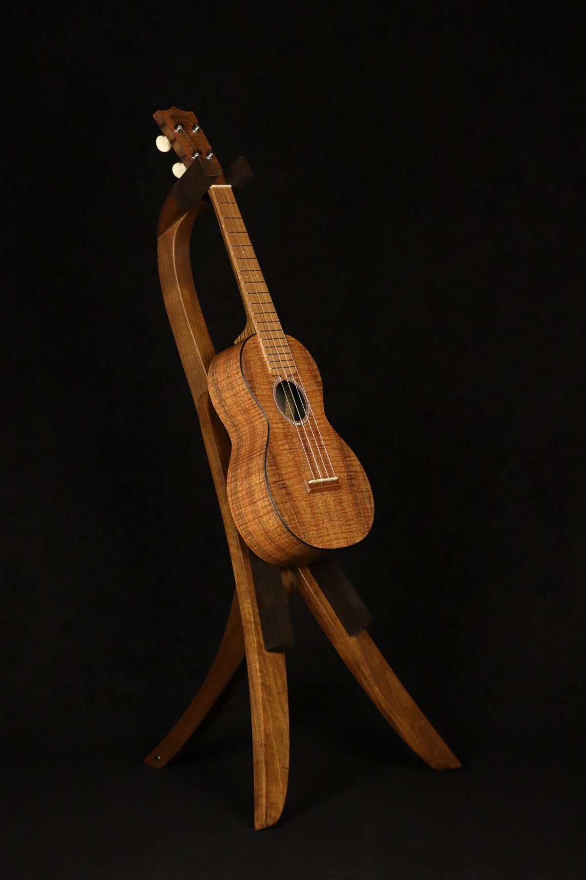 Folding walnut wood ukulele floor stand full front image with Martin ukulele