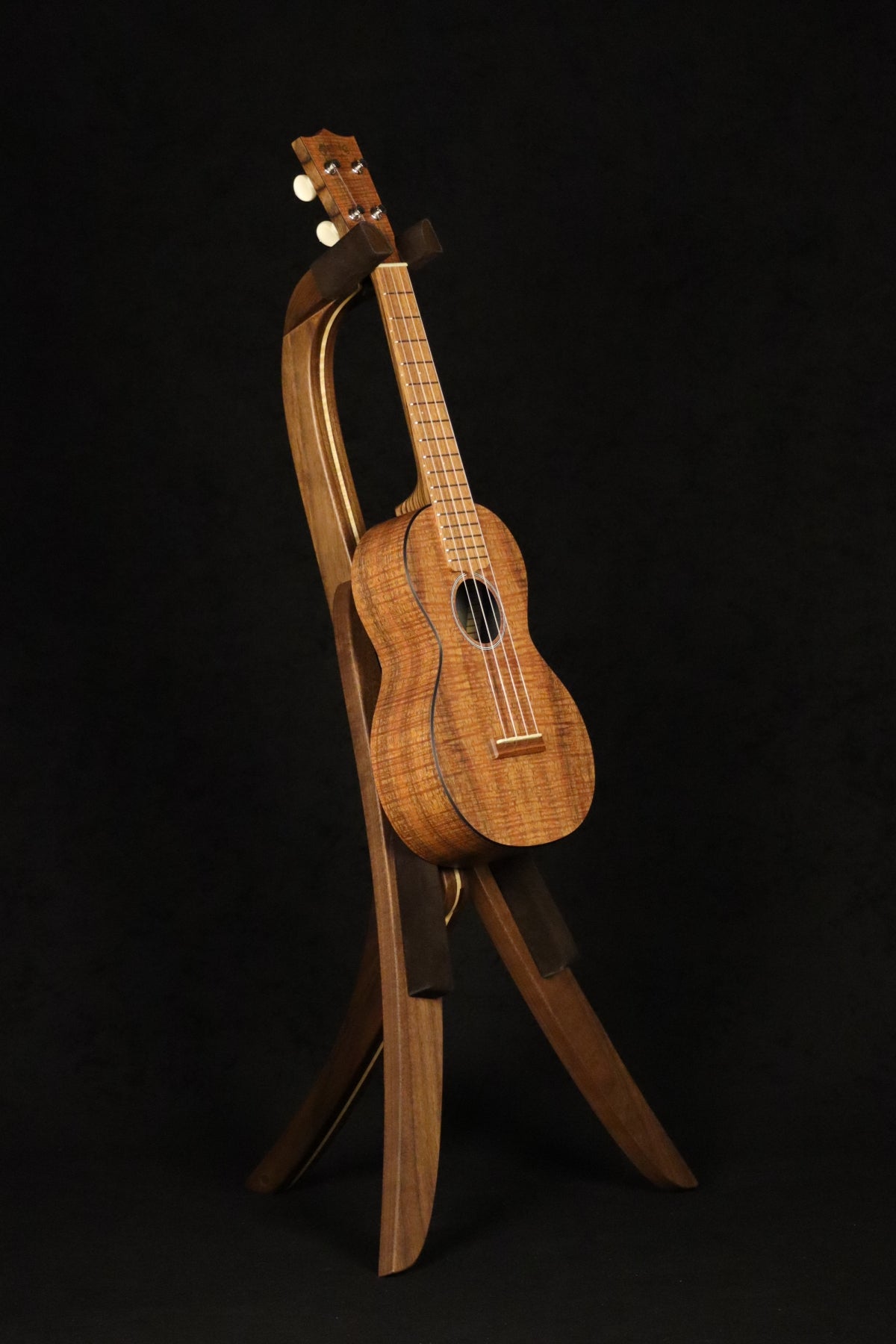 Folding walnut and curly maple wood ukulele floor stand full front image with Martin ukulele