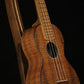 Folding walnut and curly maple wood ukulele floor stand closeup front image with Martin ukulele