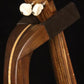 Folding walnut and curly maple wood ukulele floor stand yoke detail image with Martin ukulele