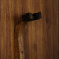 Walnut wood guitar wall mount hanger installed on paneled wall